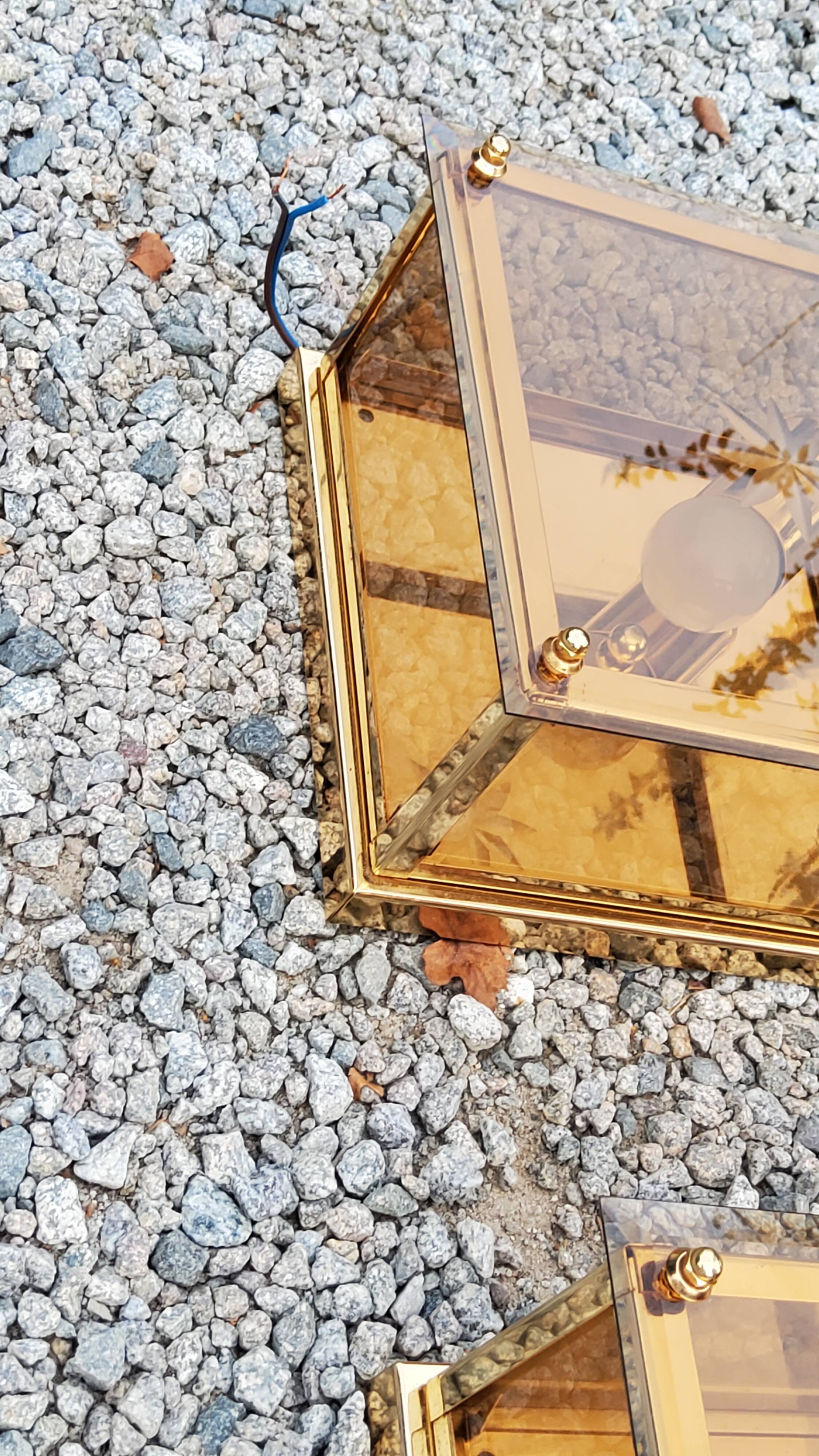 Pair of wall lamps in smoked glass and gilded metal from the 70s/80s