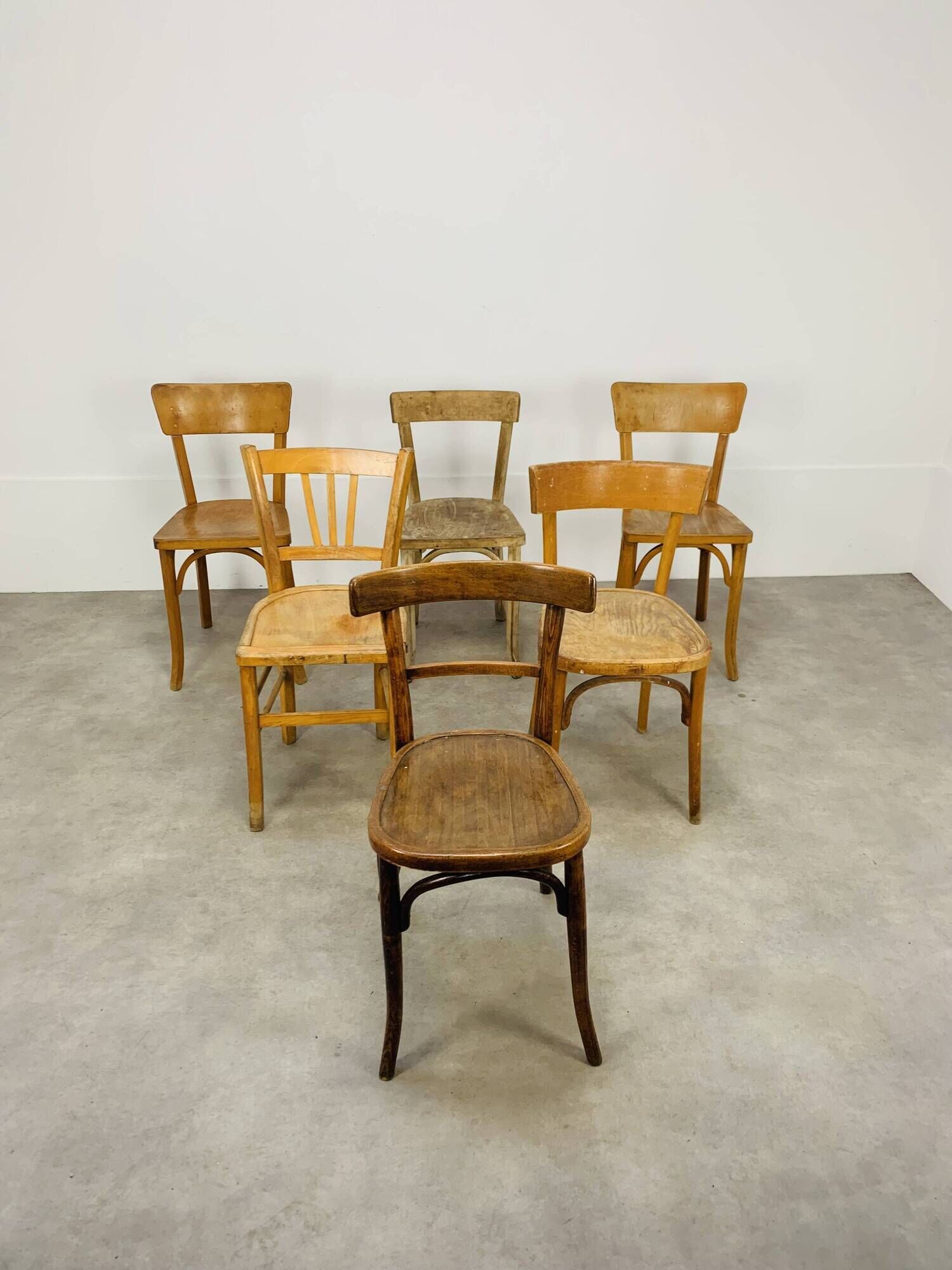 6 mismatched Baumann & Luterma bistro chairs, wood, 1960s