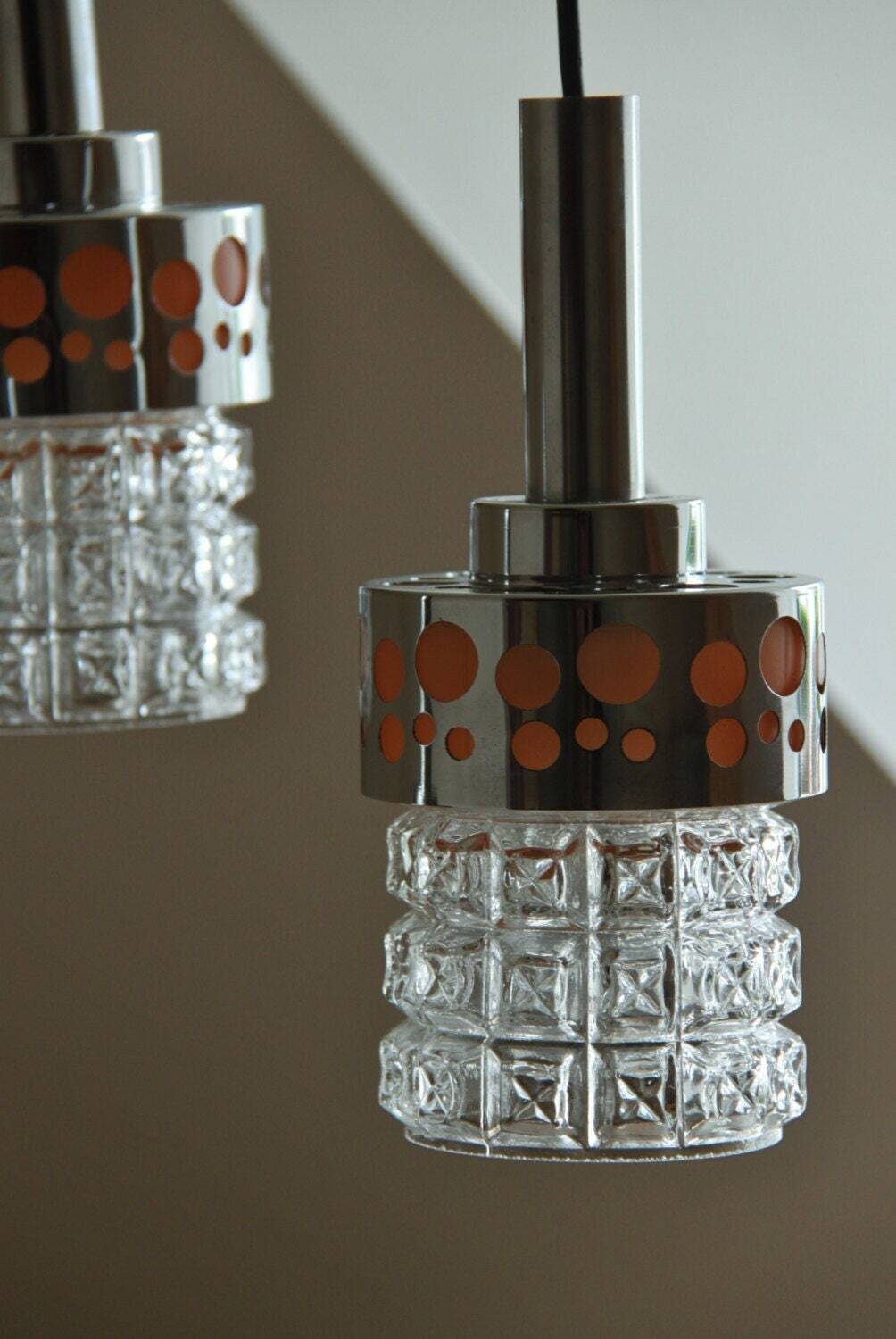 Small raak chrome and orange pendant light