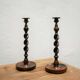 Paire de bougeoirs anciens en bois et bronze