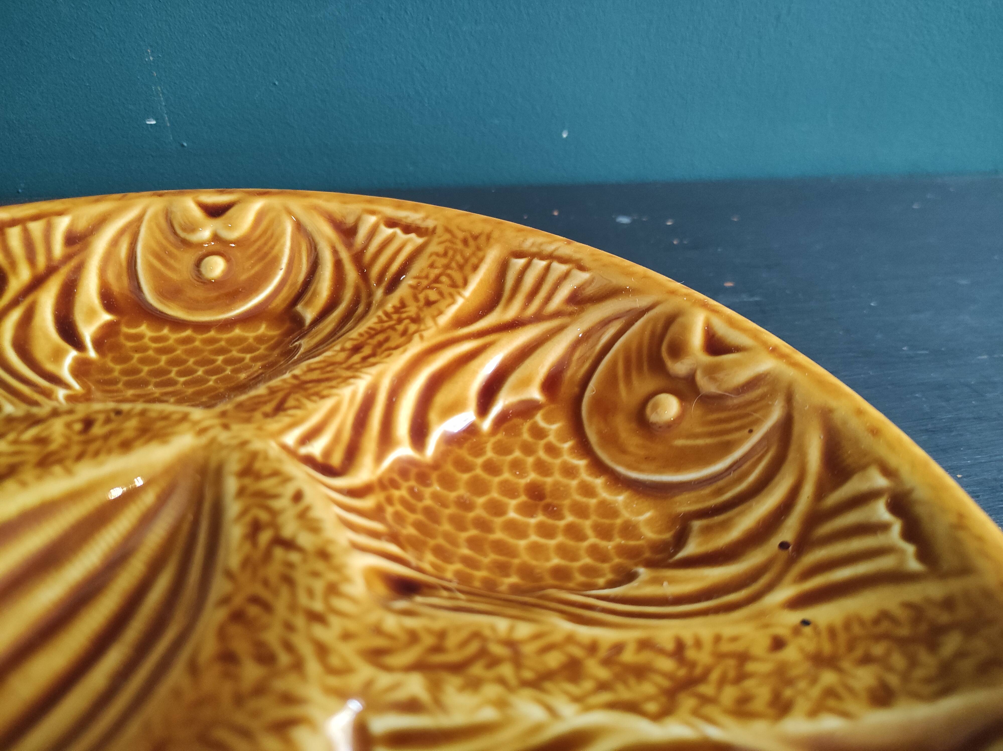 Vintage French amber oyster plate in Majolica decorated with fishes