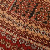 Kilim anatolien ancien tons rouges et beiges, motifs tribaux colorés