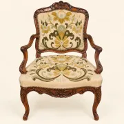 Louis XV cabriolet armchair, carved walnut, petit point tapestry, 18th century.