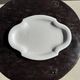 Antique oval-shaped white crackled faience plate with a scalloped edge.