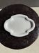 Antique oval-shaped white crackled faience plate with a scalloped edge.