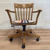 Solid wood swivel and reclining armchair.