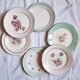 Flat antique earthenware plates with gilded edges