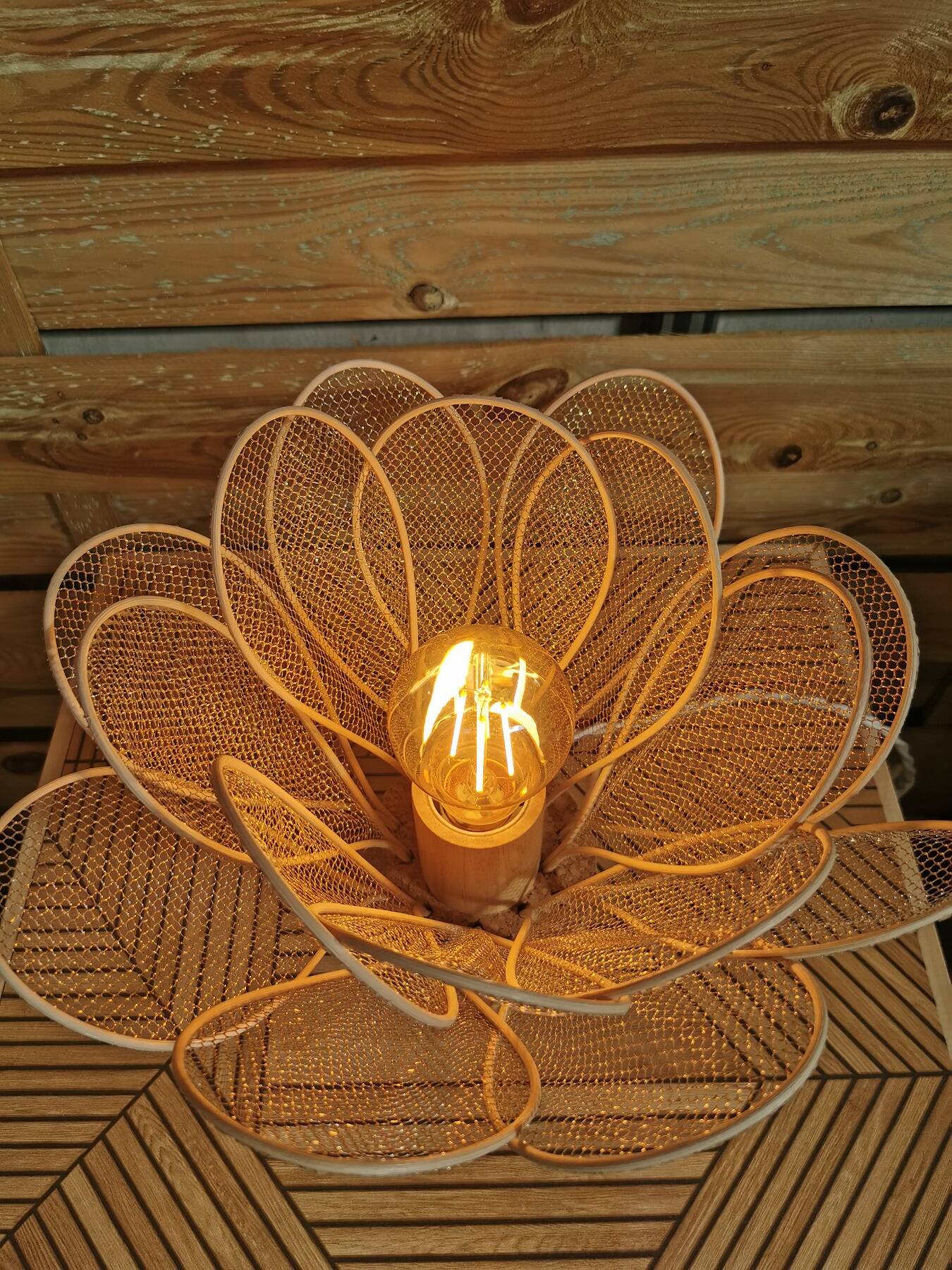 Flower table lamp made of rattan petals and gold mesh