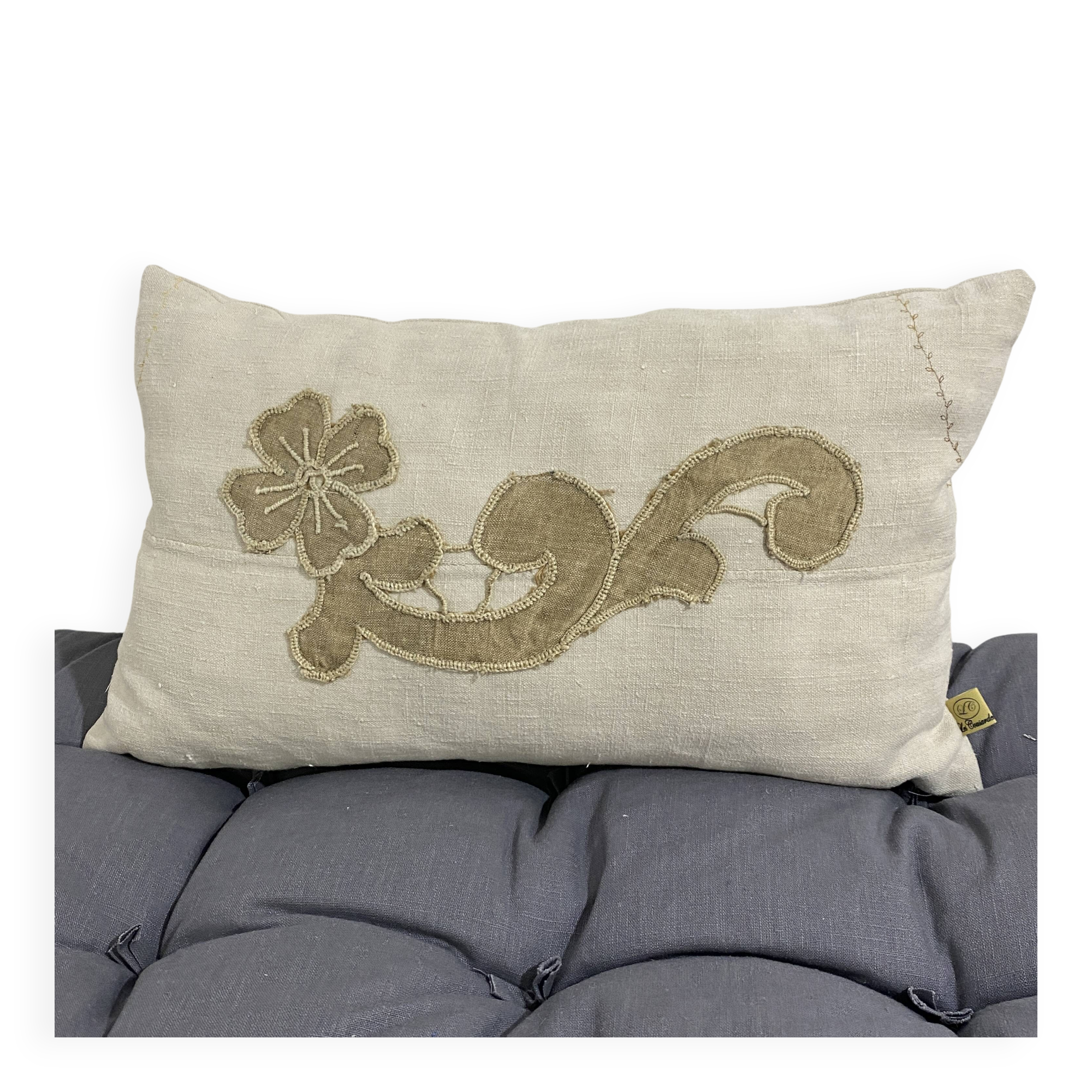Cushion in vintage fabric with ornamentation