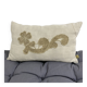Cushion in vintage fabric with ornamentation.