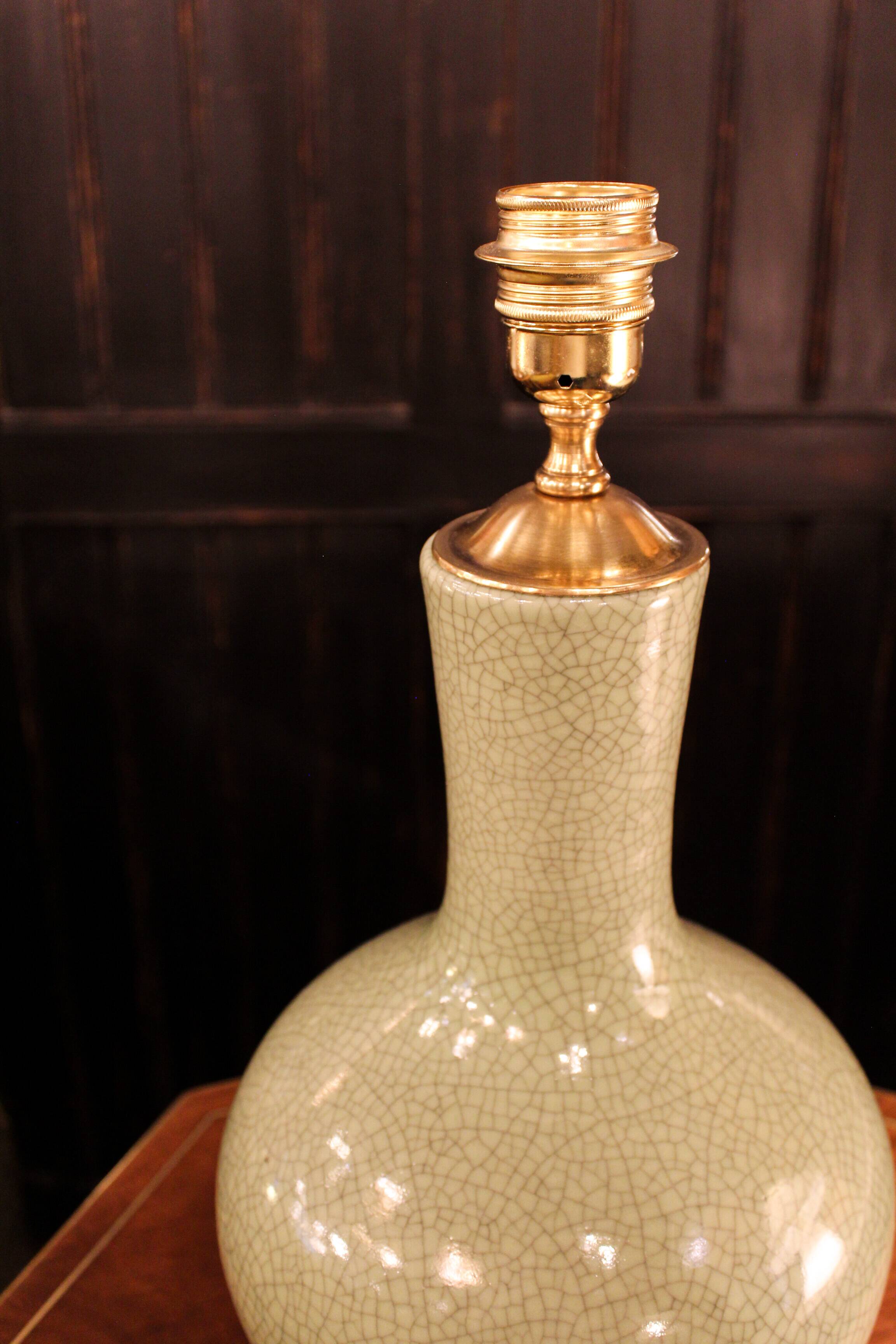 Ceramic lamp with a crackled celadon green finish.