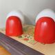 Pair of vintage wall lights in plastic and white opaline glass.