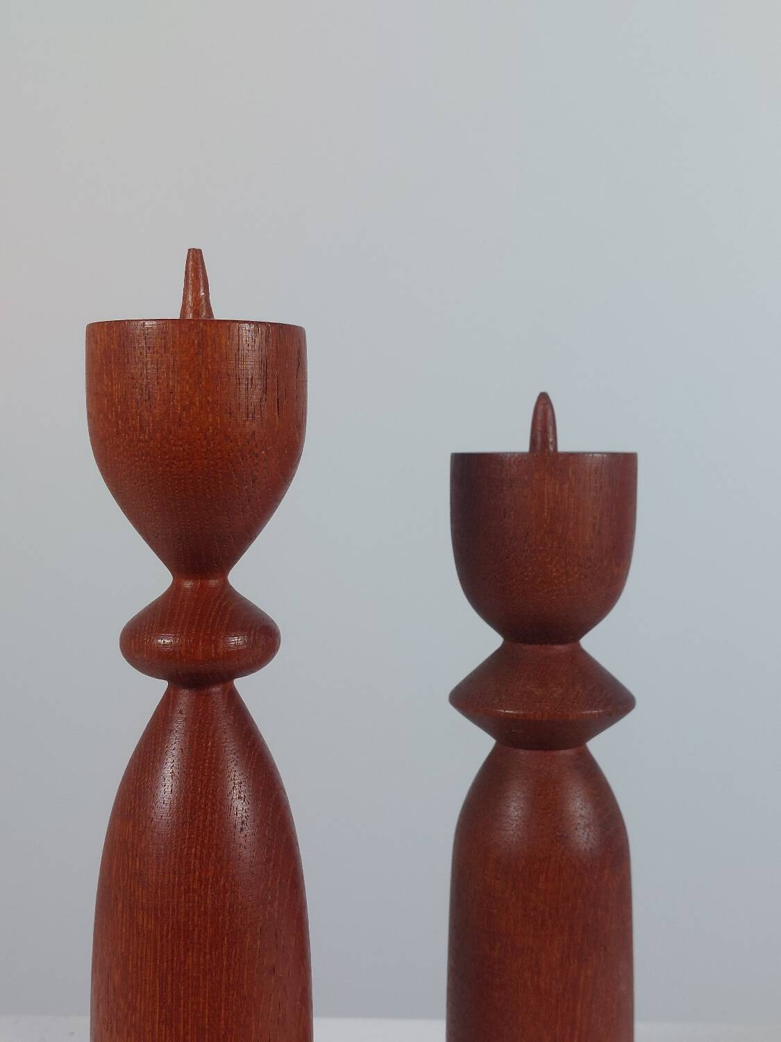 Vintage pair of sculptural teak candlesticks in Scandinavian style.