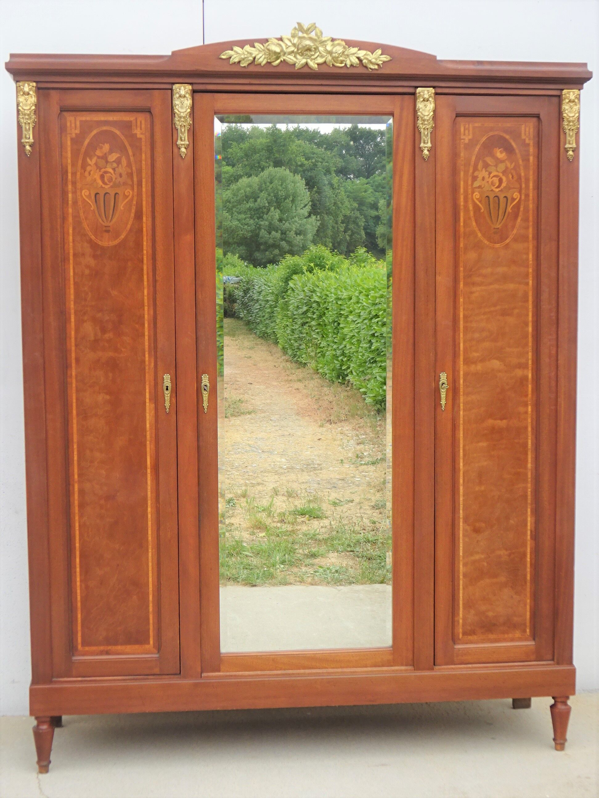Louis XVI style wardrobe late nineteenth century, mahogany and marquetry