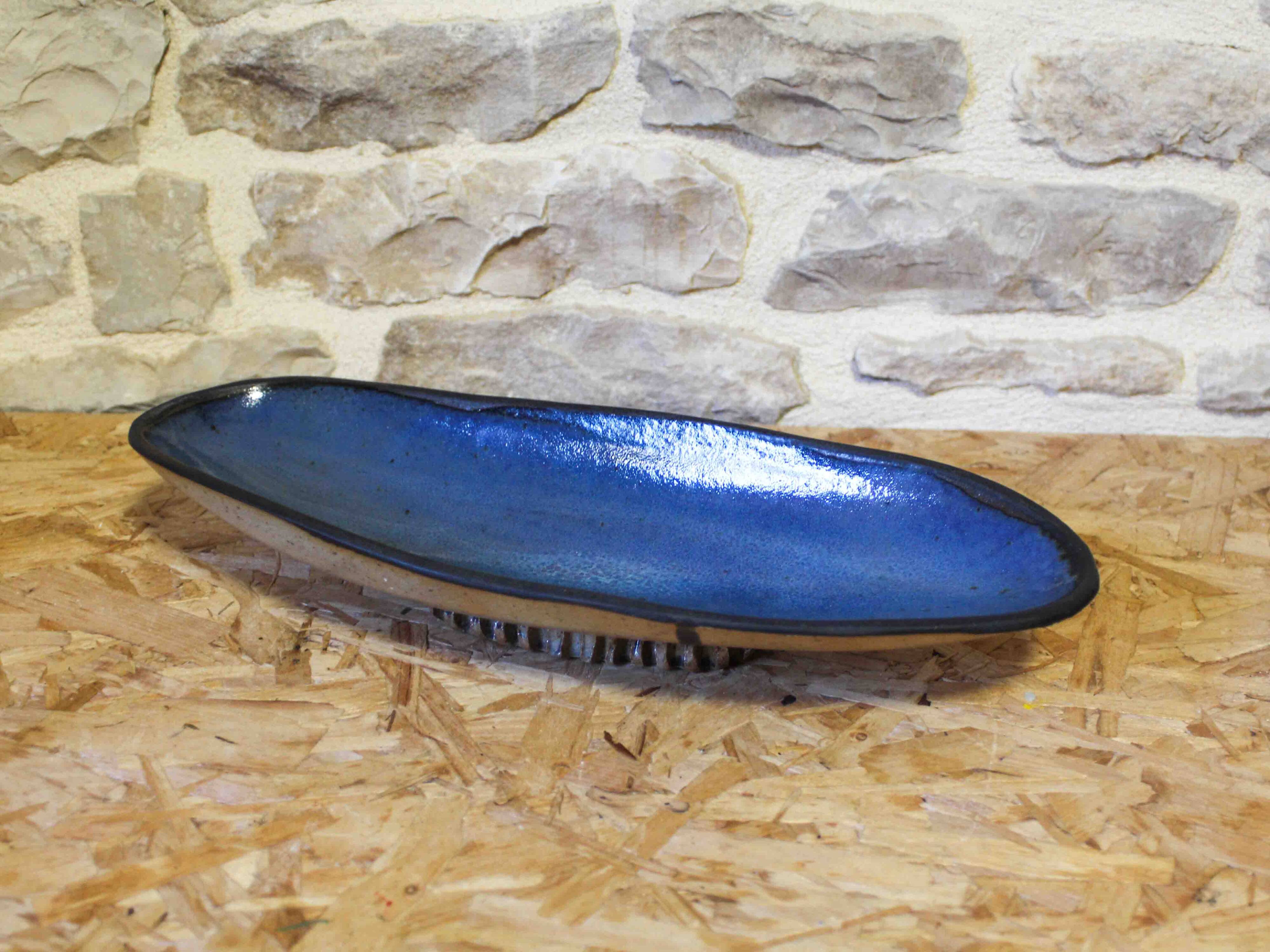 Blue glazed ceramic cup