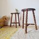 Wooden tripod stools - pair of turned leg bedside tables