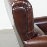 Fauteuil anglais ancien en cuir de mouton