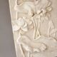 Bas-relief with flowers. Relief with flowers. Flowers in relief.