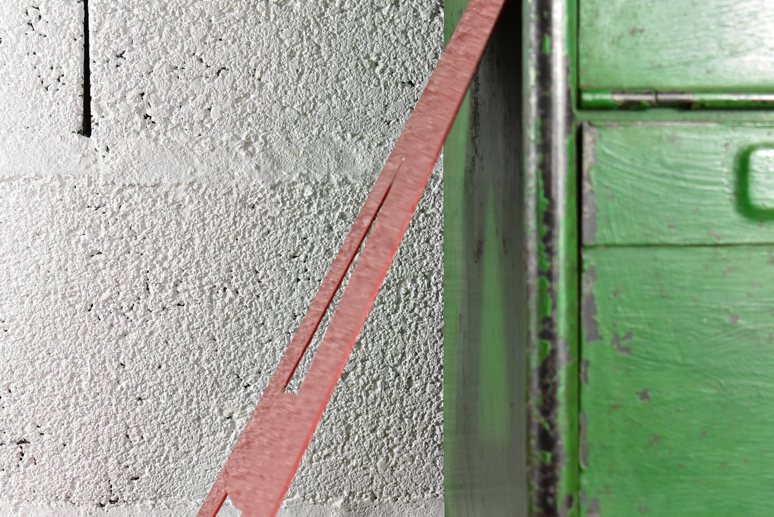 Industrial letter "I" in red metal