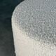 Totemo stool by forme, ivory dedar bouclé upholstery, walnut legs