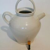 Old jug chevrette gargoulette in varnished white sandstone