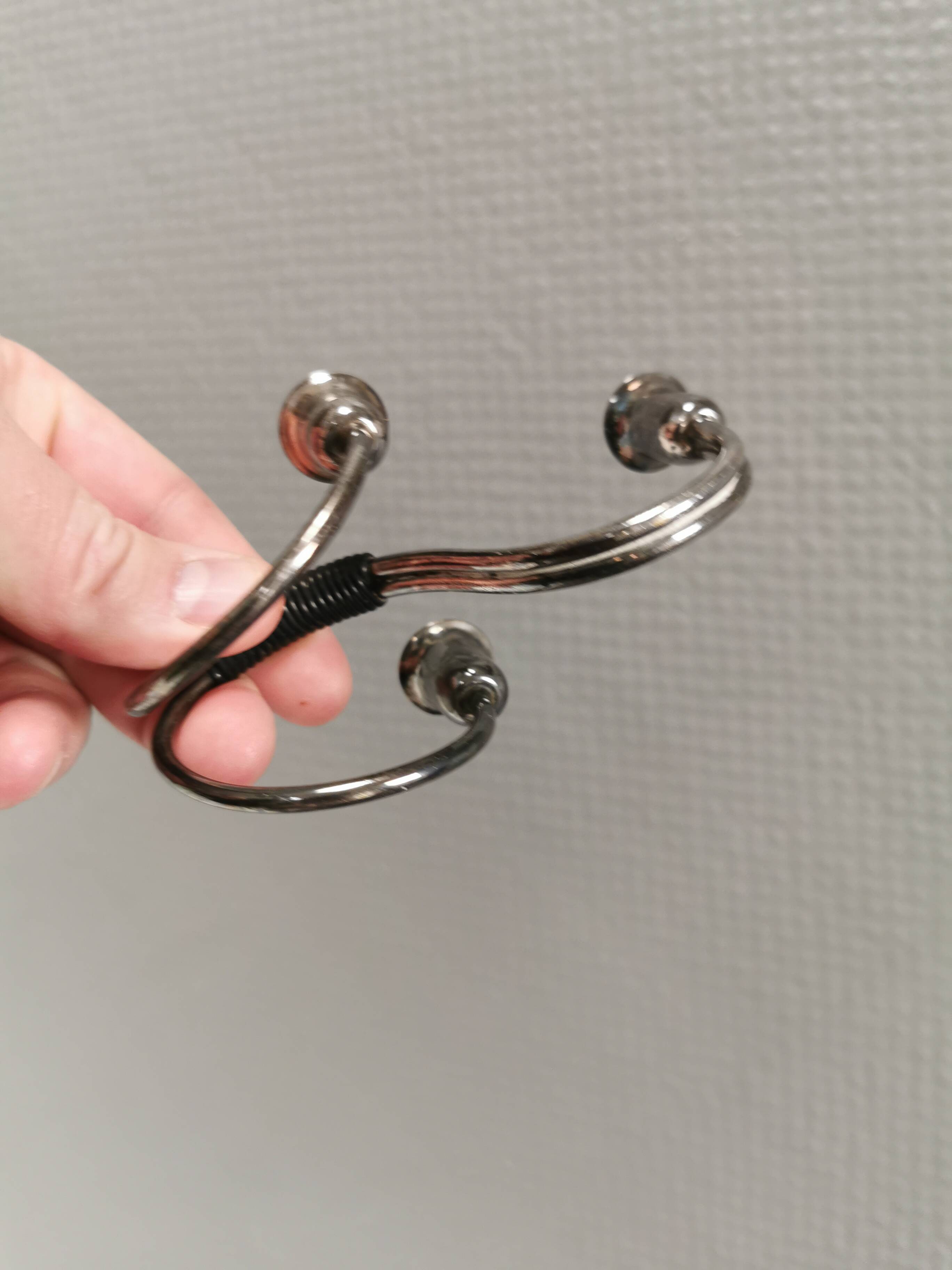 Small candle holder in tarnished silver, with place for three small candles