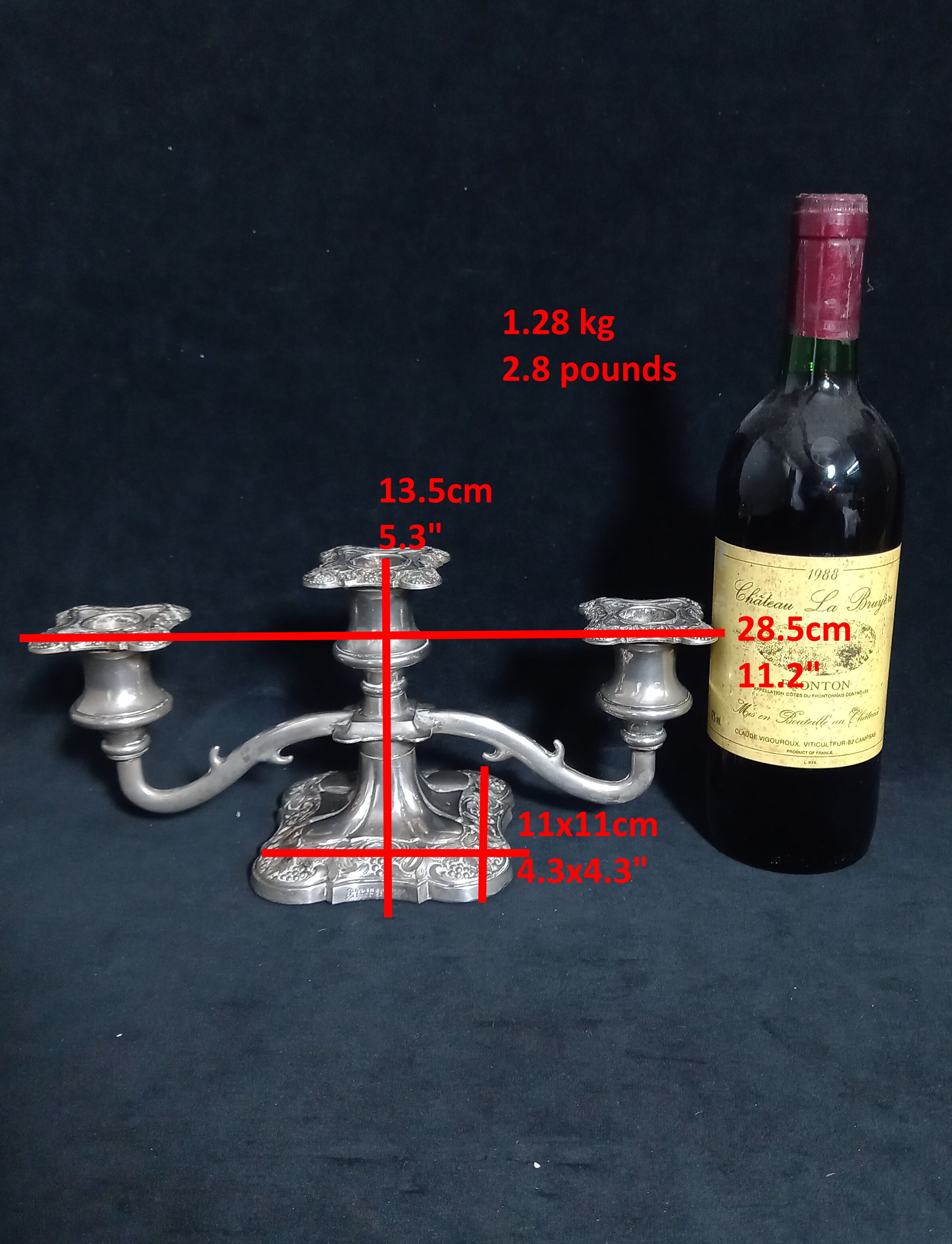 English silver metal candelabra decorated with vine leaves