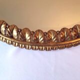 Golden mirror decorated with water leaves and palmettes