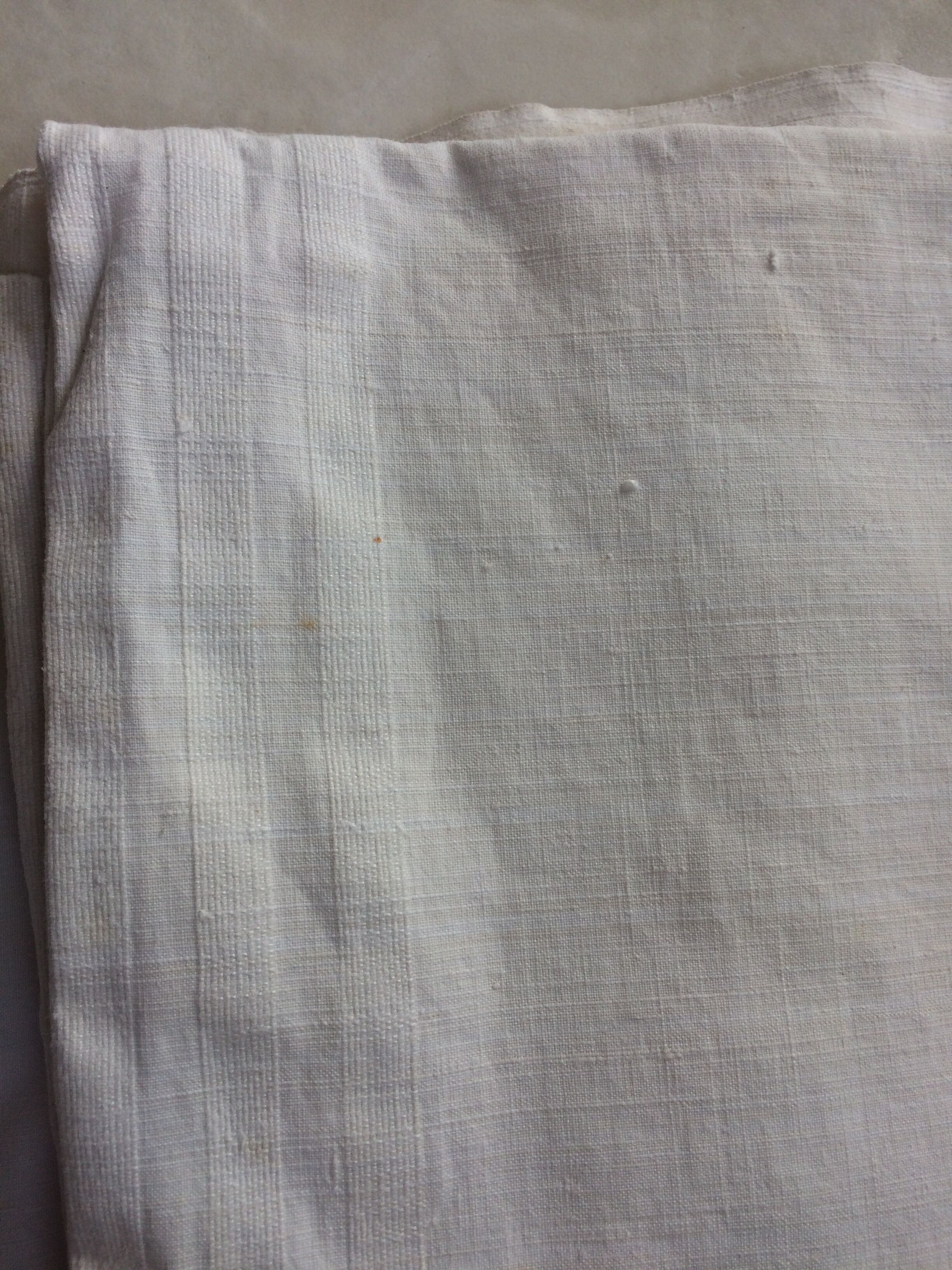 2 old white linen coats
