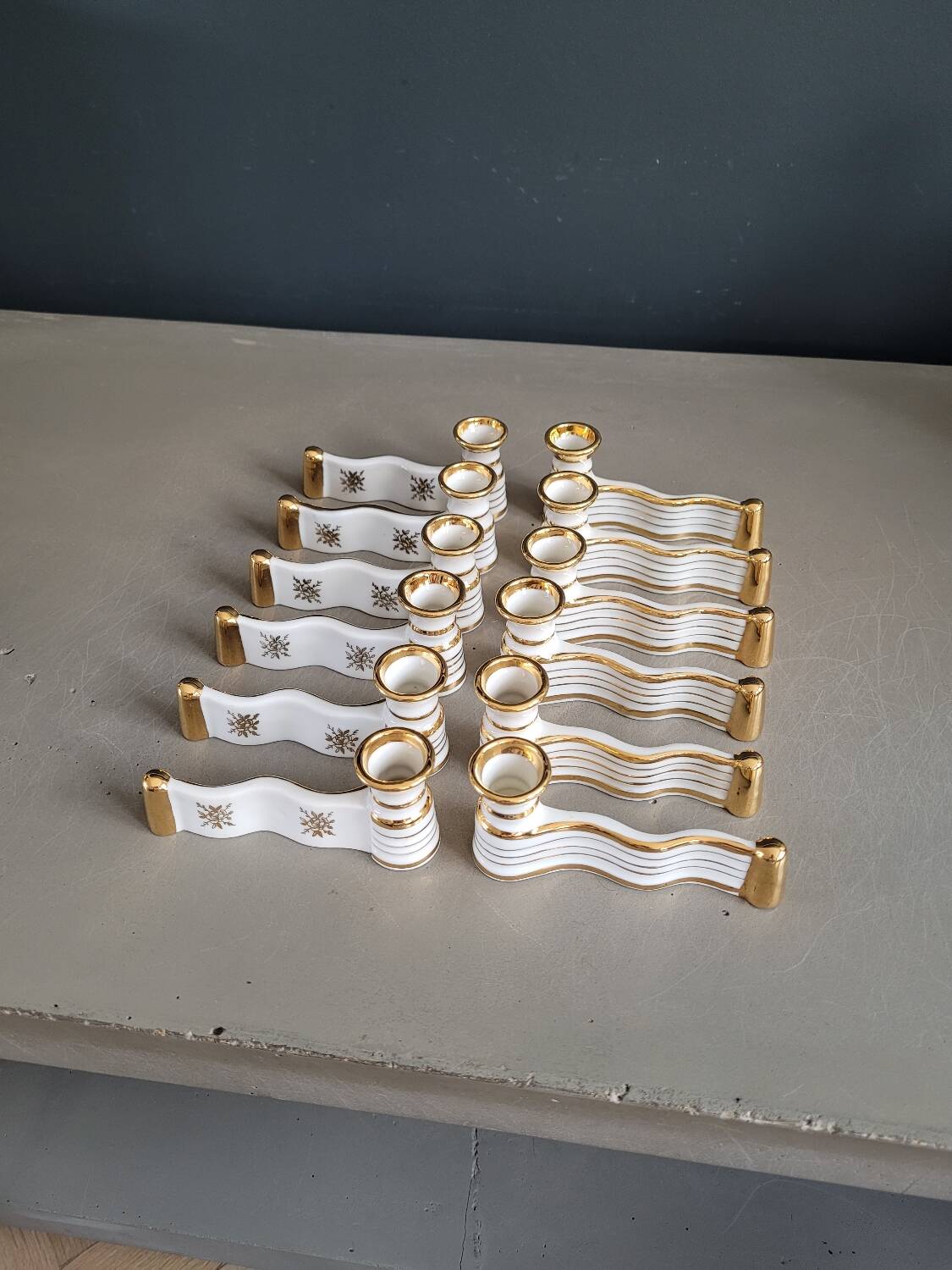 12 Limoges art porcelain knife rests in their case