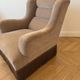 Vintage 1970s armchair in beige fabric with fringes.