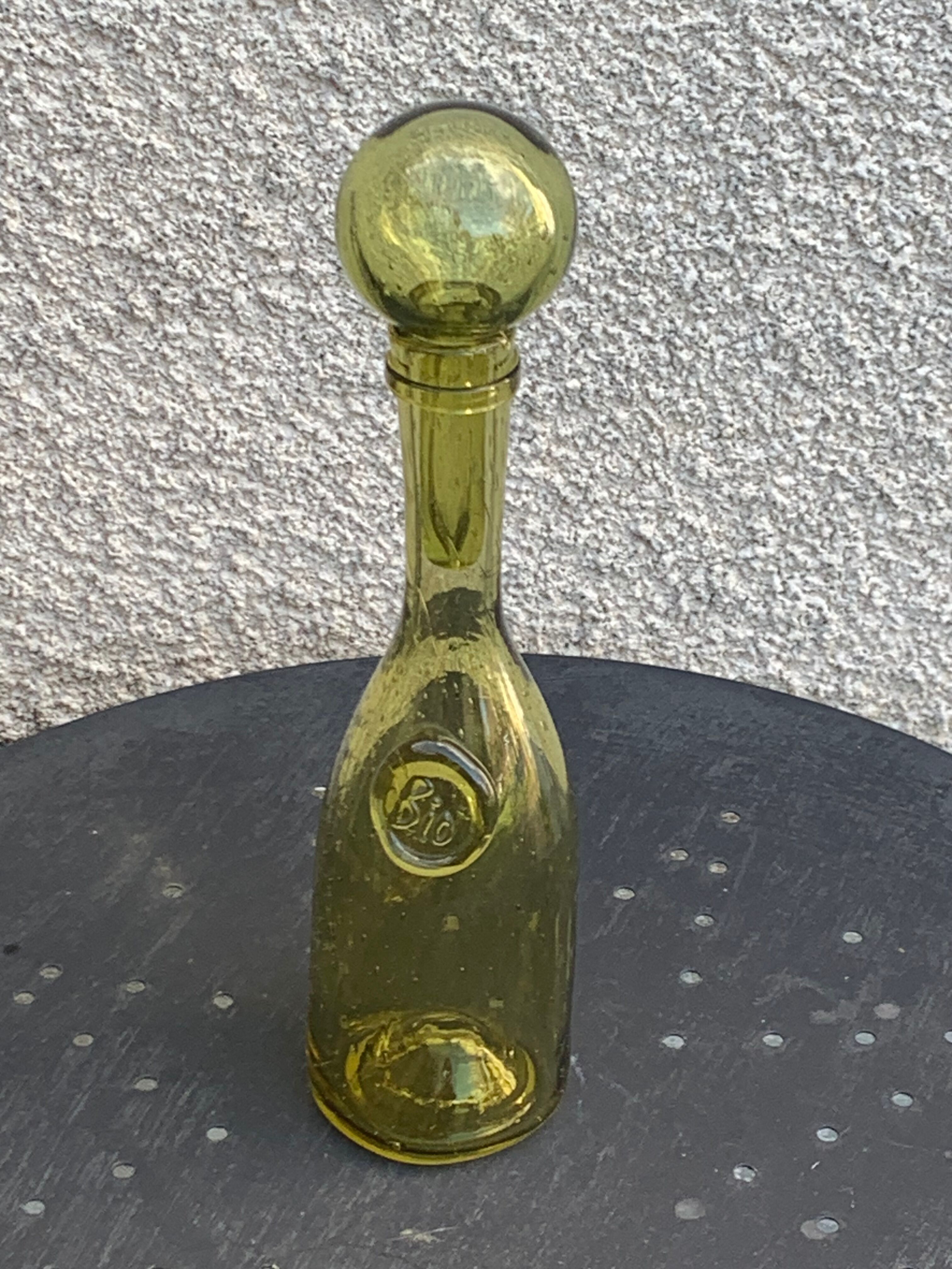 Glassblown glass decanter from the Biot collector glassworks