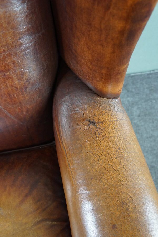 Armchair in patinated sheepskin leather