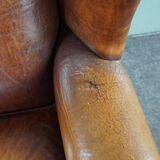 Armchair in patinated sheepskin leather