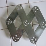 Expandable stainless steel trivet from the 50s and 60s