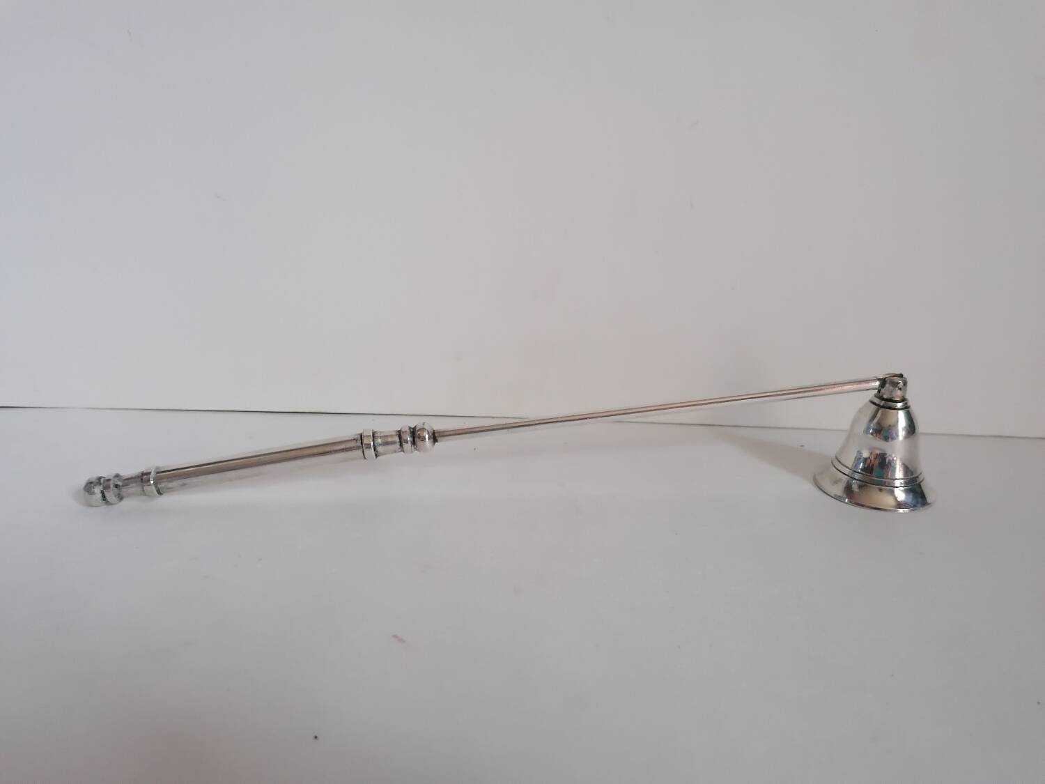 Silver metal candle snuffer