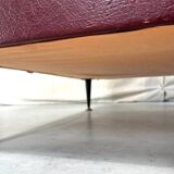 Vintage burgundy armchair, compass base in black metal and brass