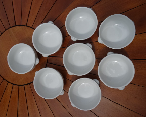 Lot of 8 ears to fire white porcelain bowls