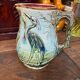 Majolica pitcher depicting a heron, 1900