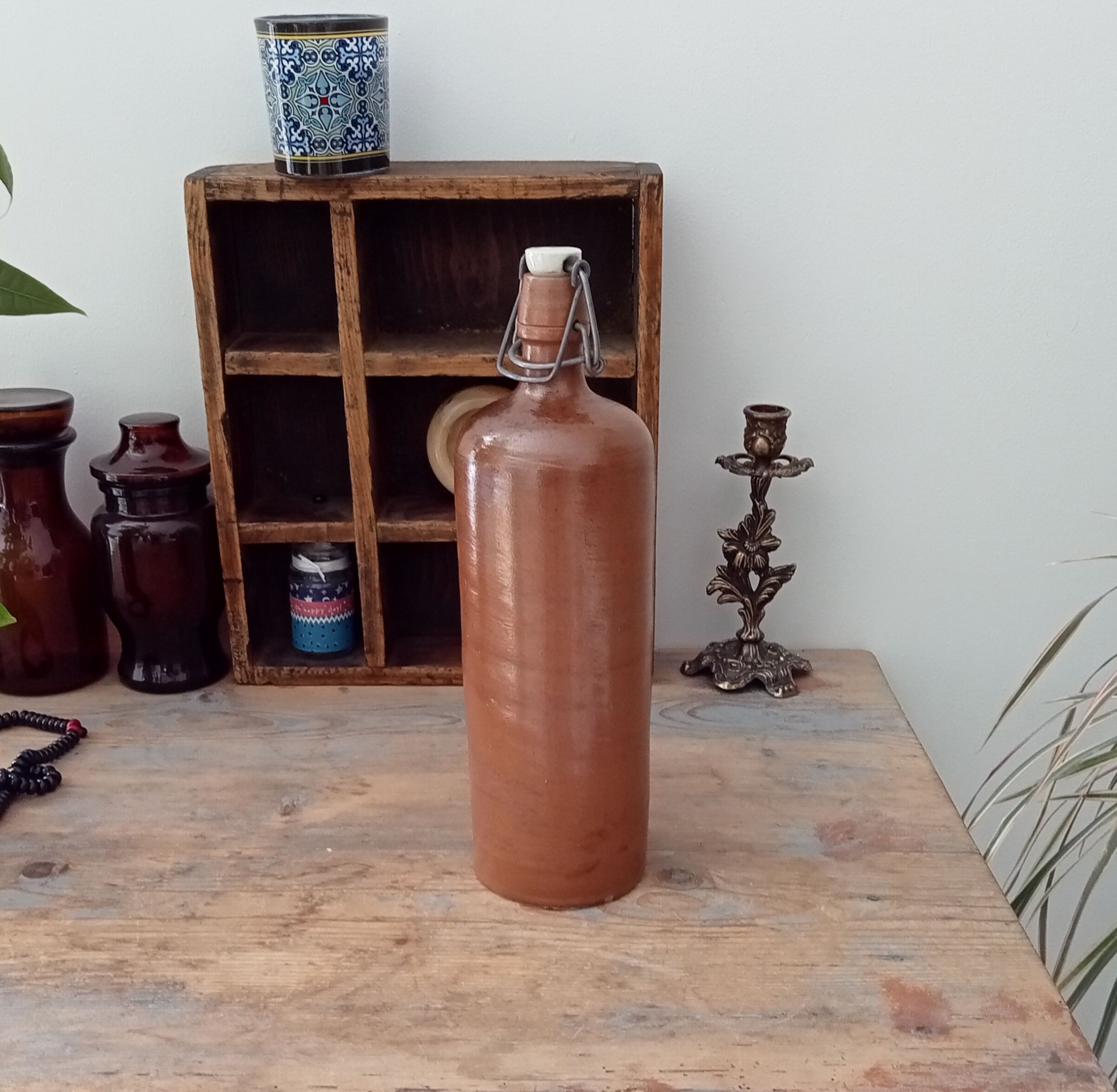 Old bottle in glazed sandstone