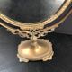 Miroir en bronze pivotant