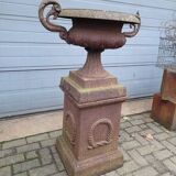 Cast iron garden urn on pedestal with handles