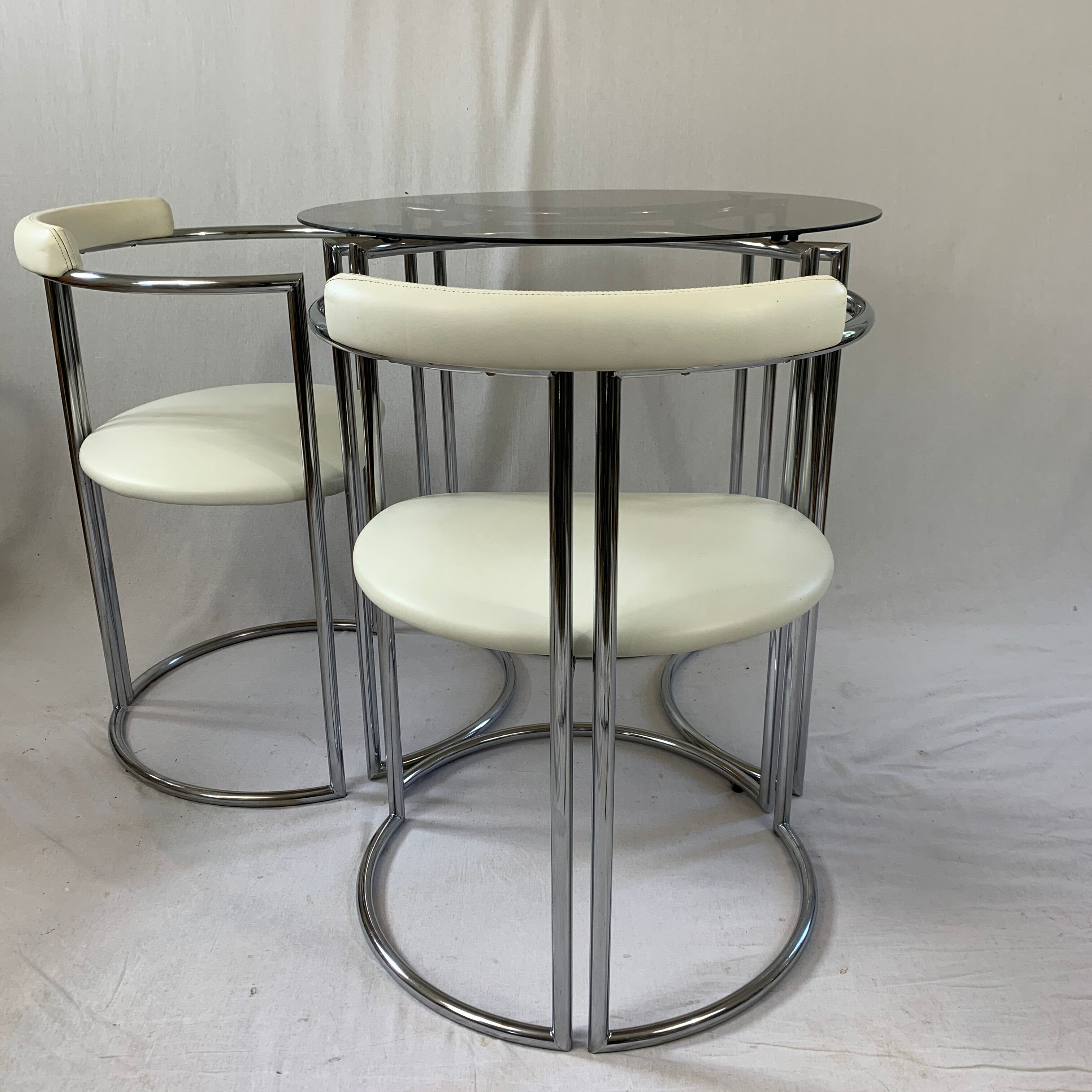Chrome table and two modernist chairs