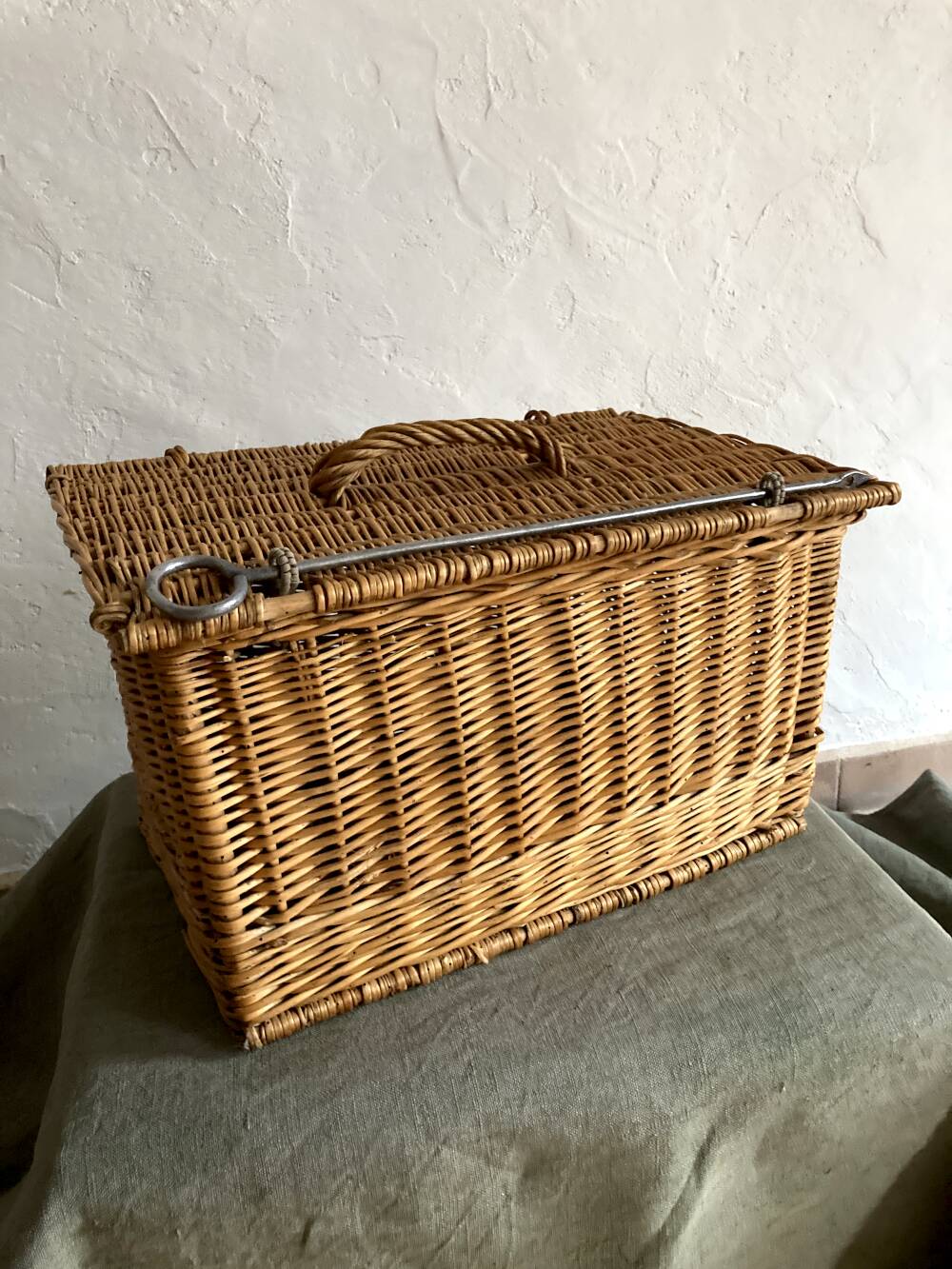 Antique wicker basket with closure and handle
