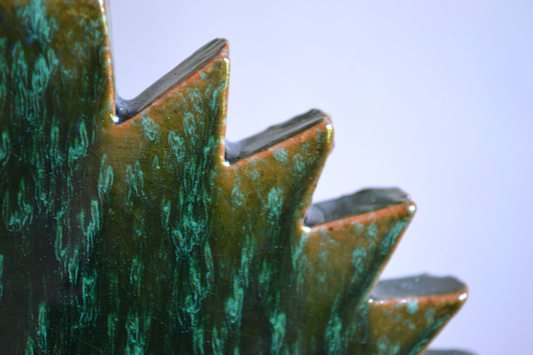 Green ceramic sun candlestick from Tamegroute, Morocco.