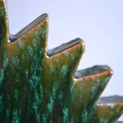 Green ceramic sun candlestick from Tamegroute, Morocco.