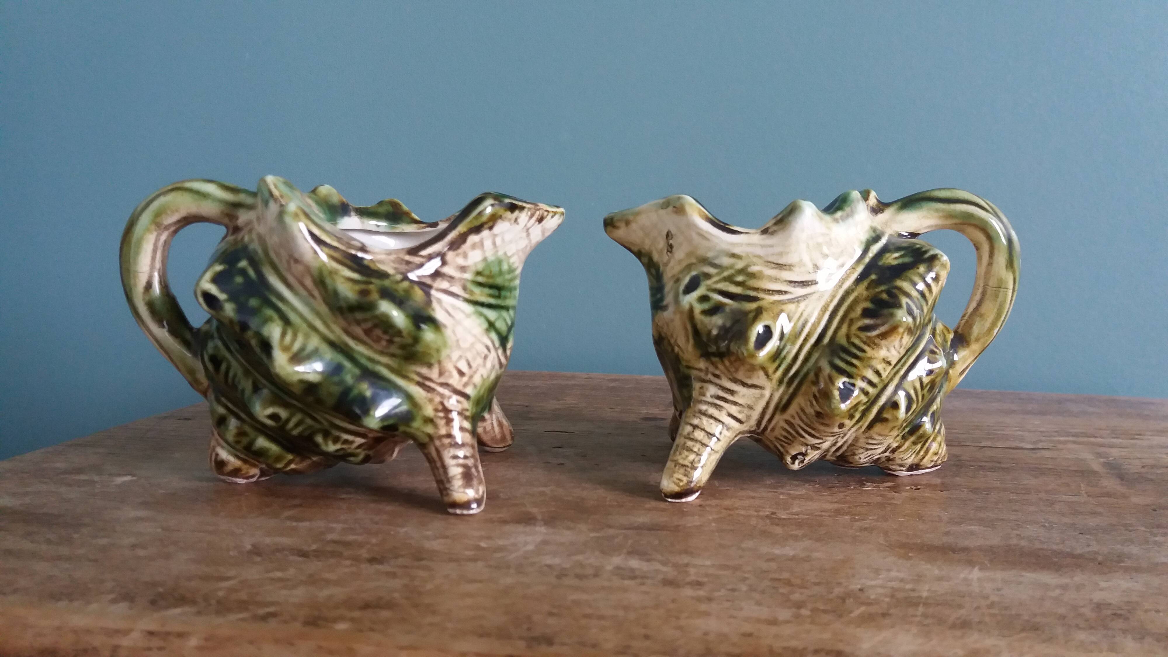 Animal-shaped milk jug shell in slipware.