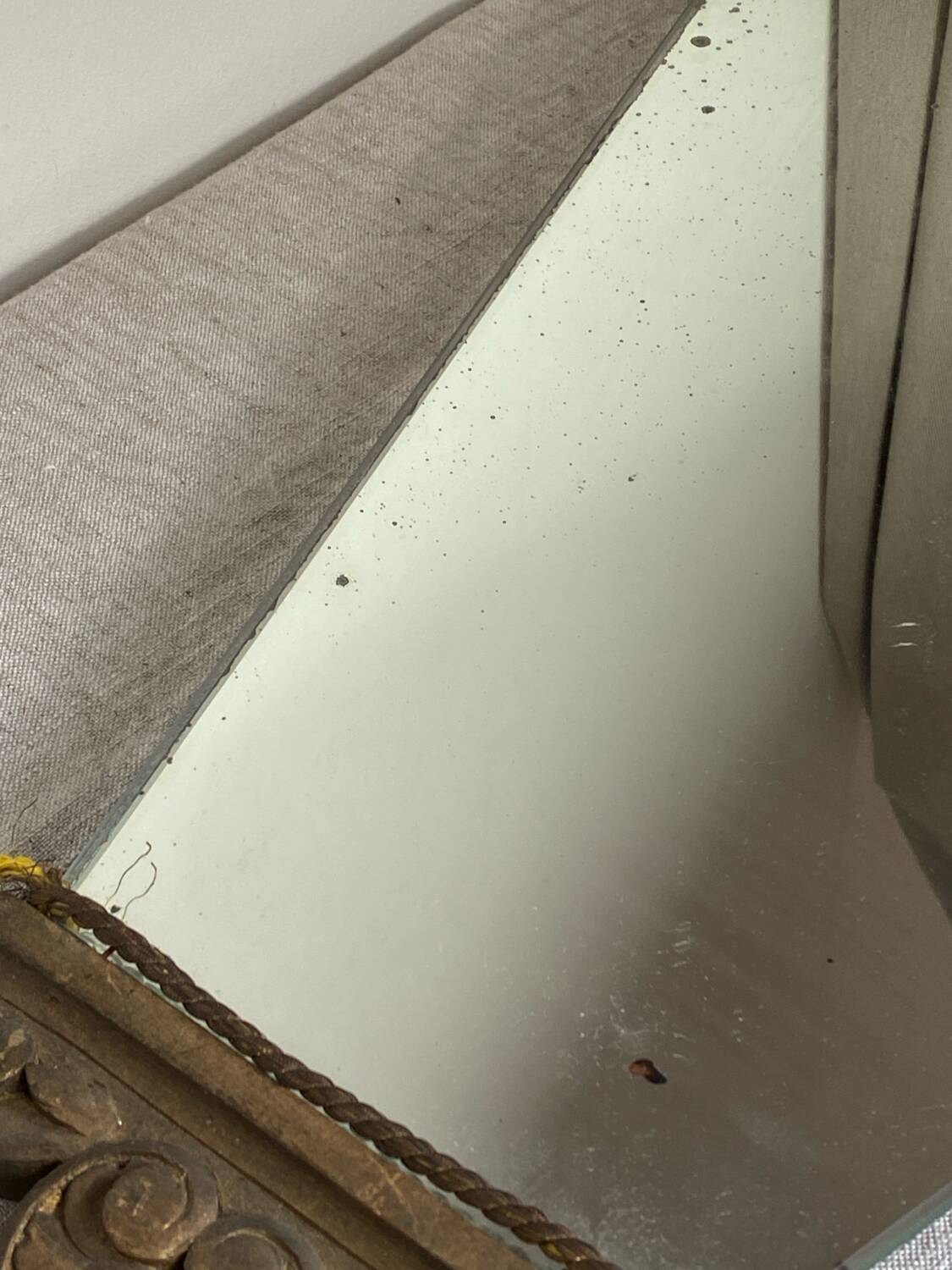 Antique wooden mirror with an unusual shape