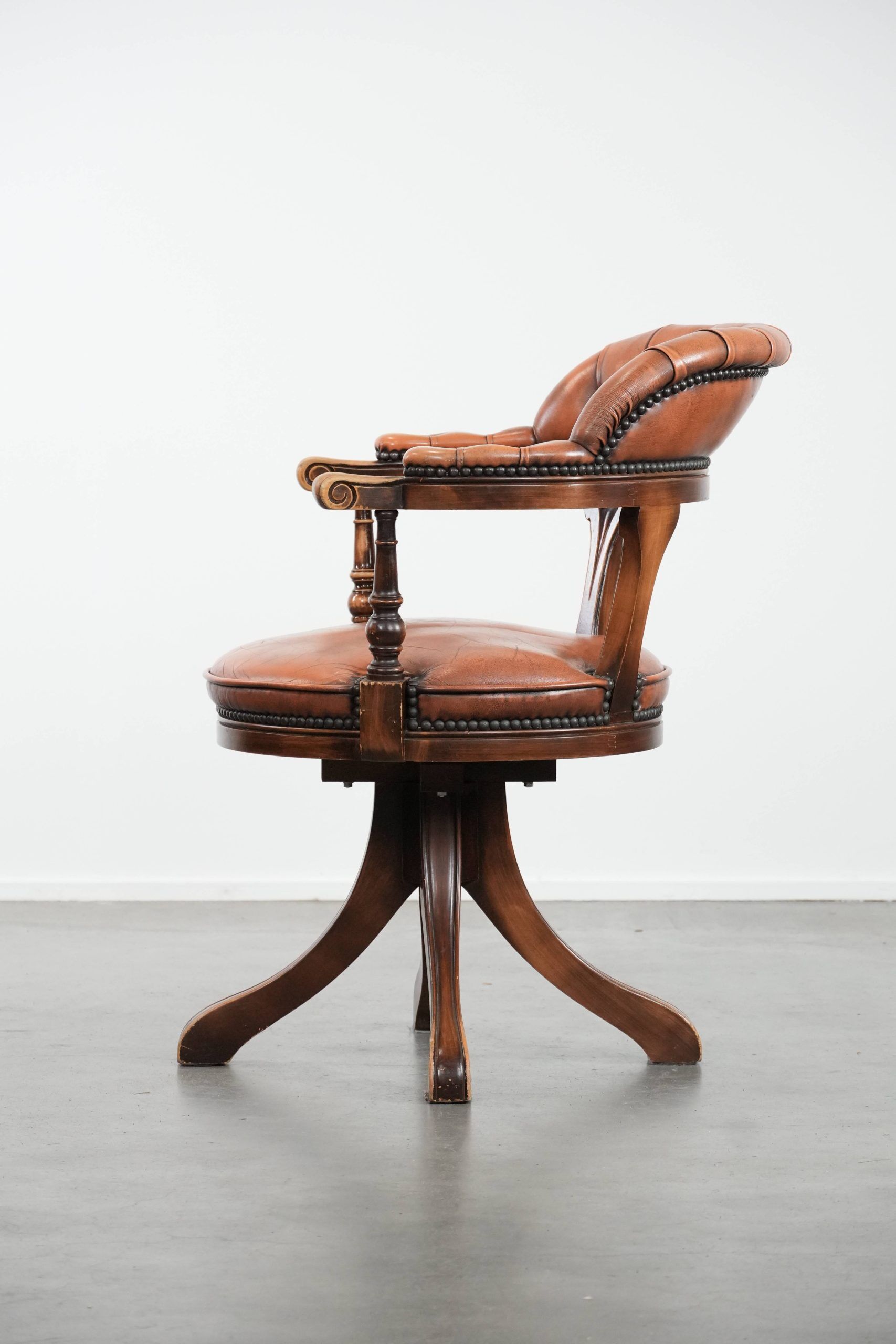 Classic and timeless cow leather and wooden Chesterfield office chair