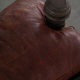 Dark red upholstered camel saddle stool, 20th century, North Africa.